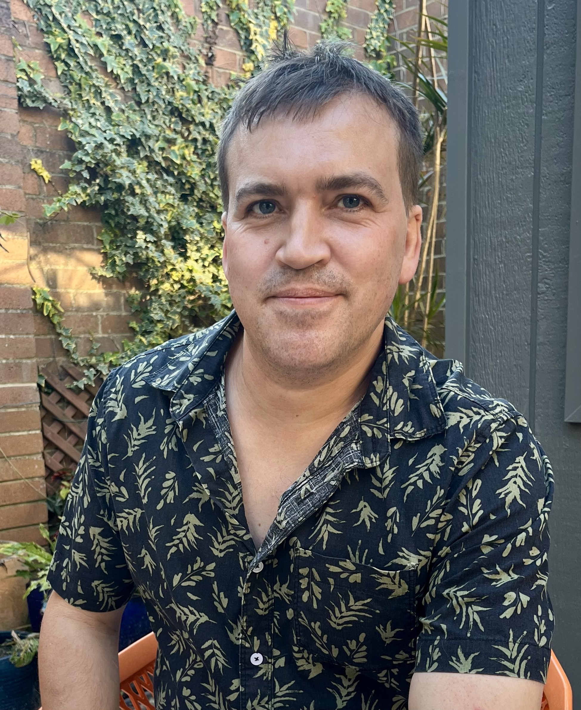 Nicholas Marriott, architectural acoustics expert and Master Builder, pictured in an outdoor setting. His work integrates technical expertise in audio engineering with sustainable architecture.