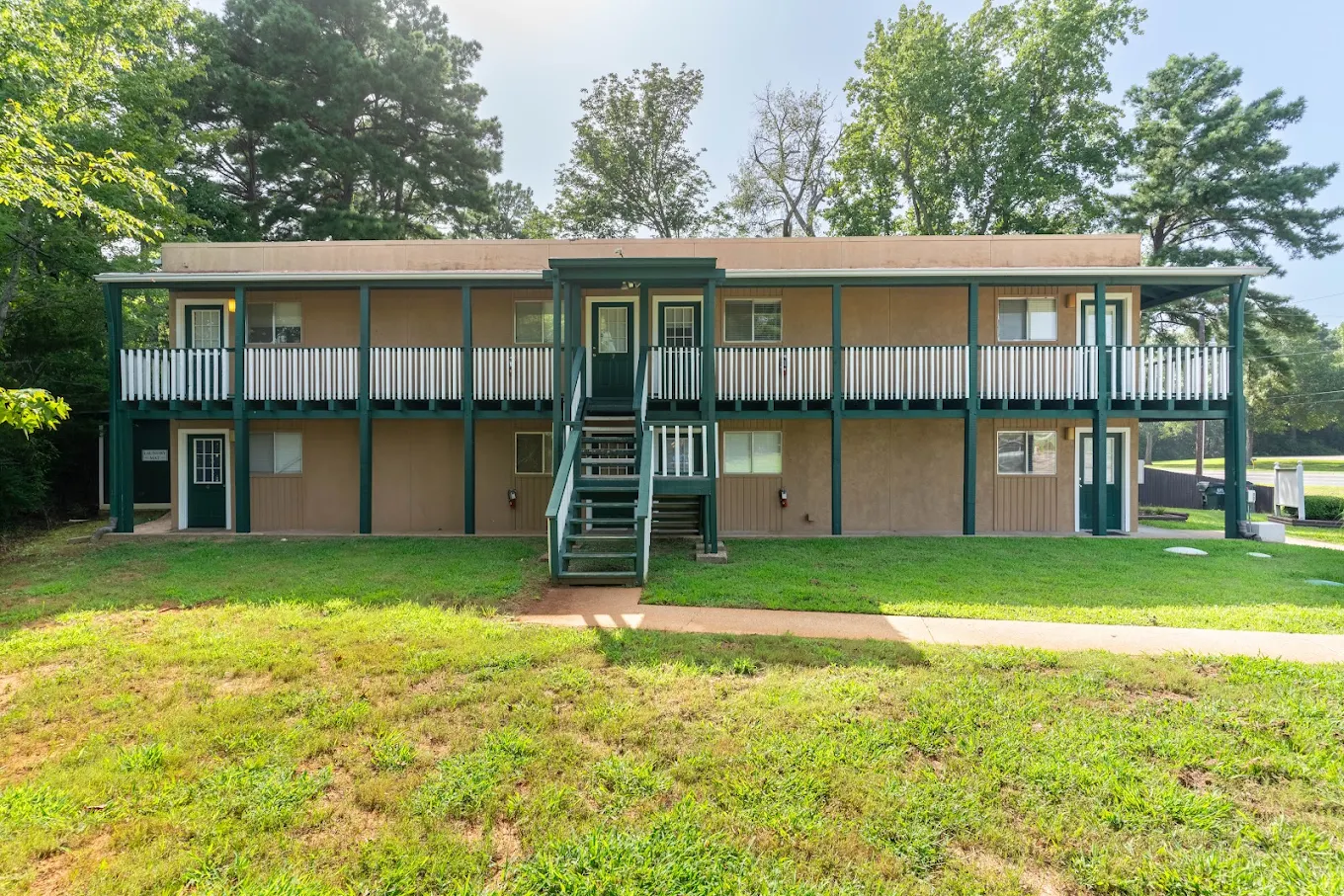 Brick apartment community with pool and walkways in Fort Worth, TX