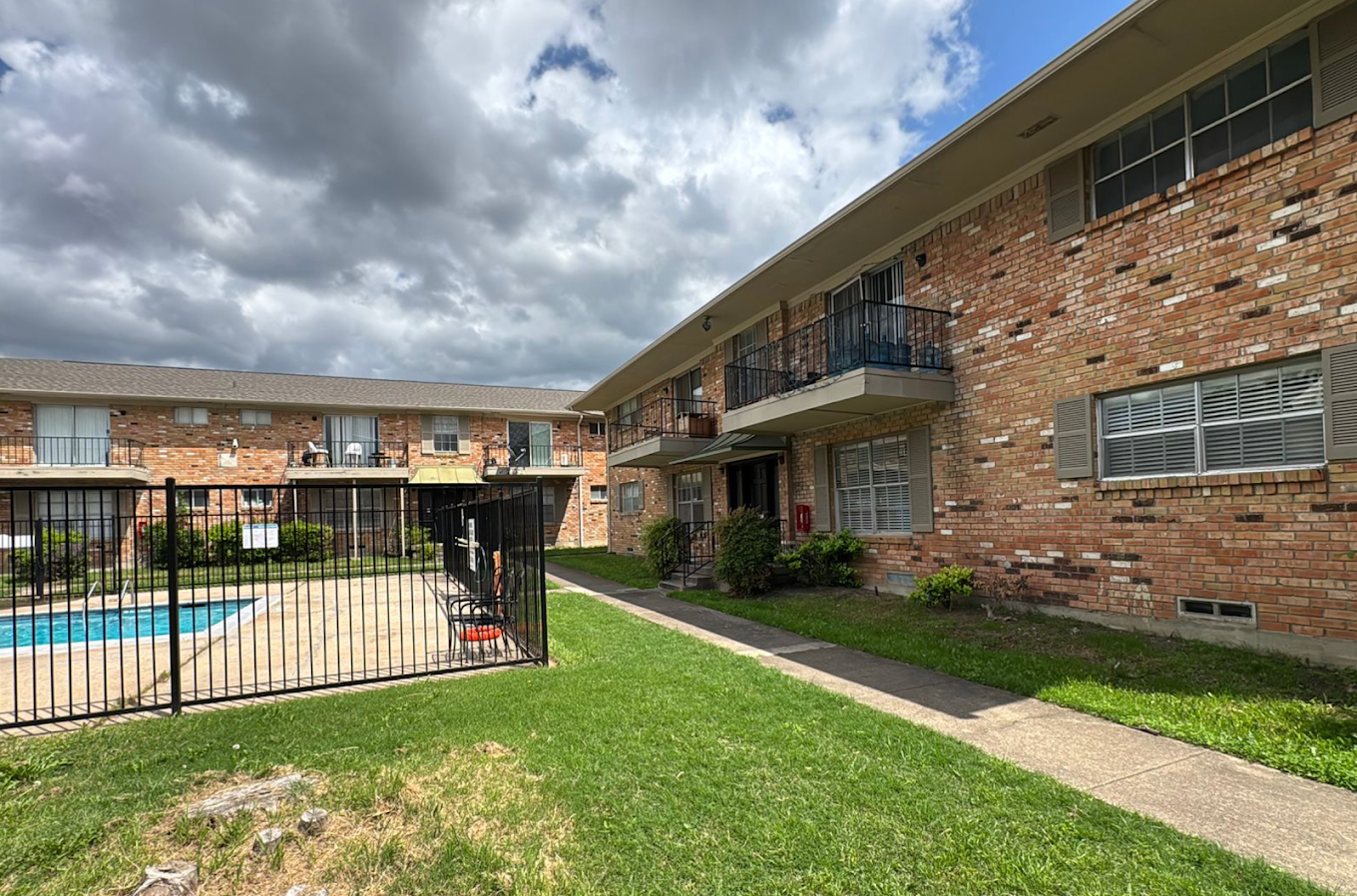 Two-story multifamily exterior with balcony and stairs in Fort Worth, TX