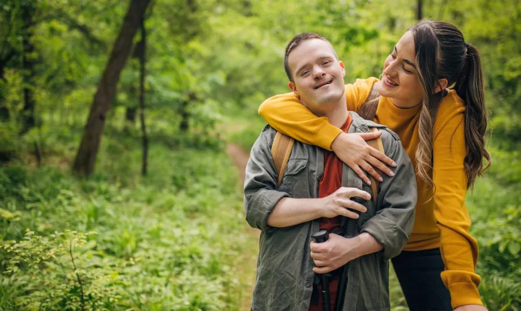 A family guardian on a hike with a family member