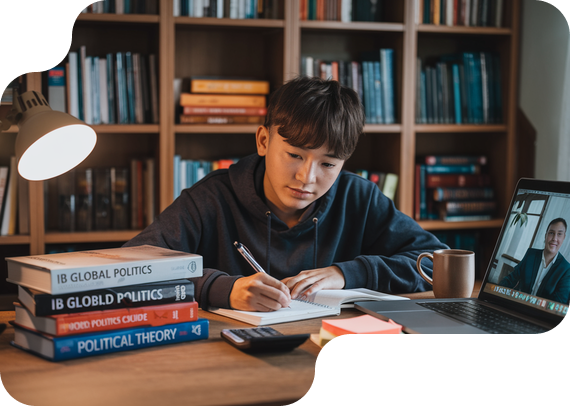 Student studying IB Global Politics with textbooks and online tutor