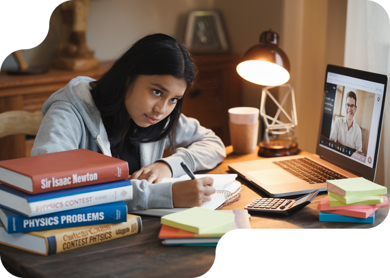 Student preparing for Sir Isaac Newton Physics exam with prep books and online tutor