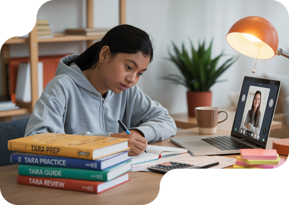 Student preparing for TARA admissions test with prep books and online tutor