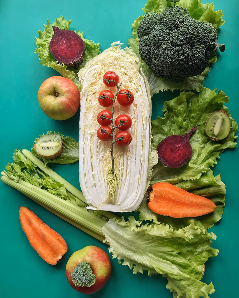 fruits and vegetables overlayed over a green background