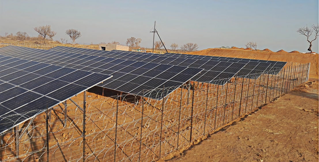 a solar panels on a fence