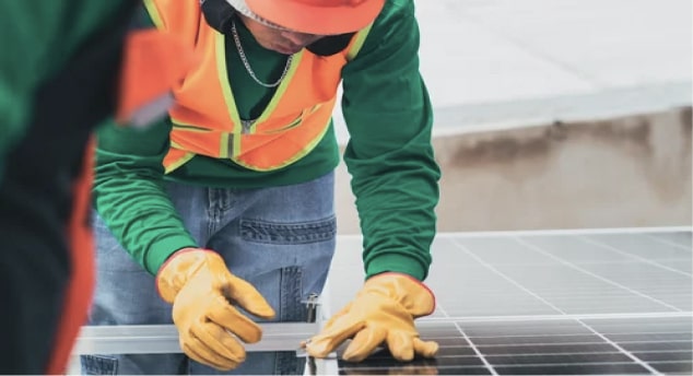 a man wearing a safety vest and gloves