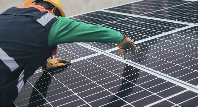 a man installing solar panels