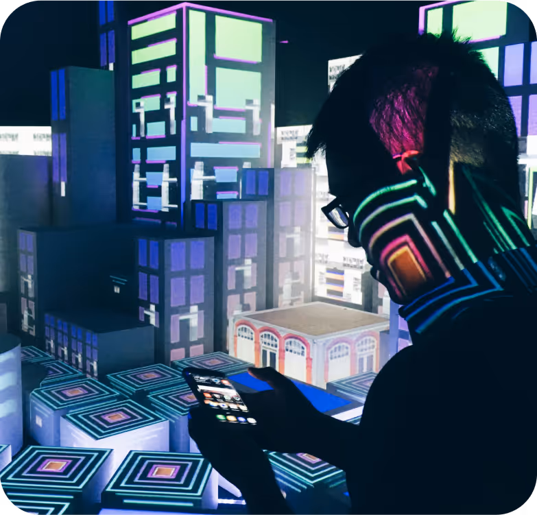 A person with headphones on looking at a cell phone.