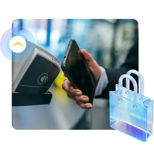 A person holding a cell phone next to a shopping bag.