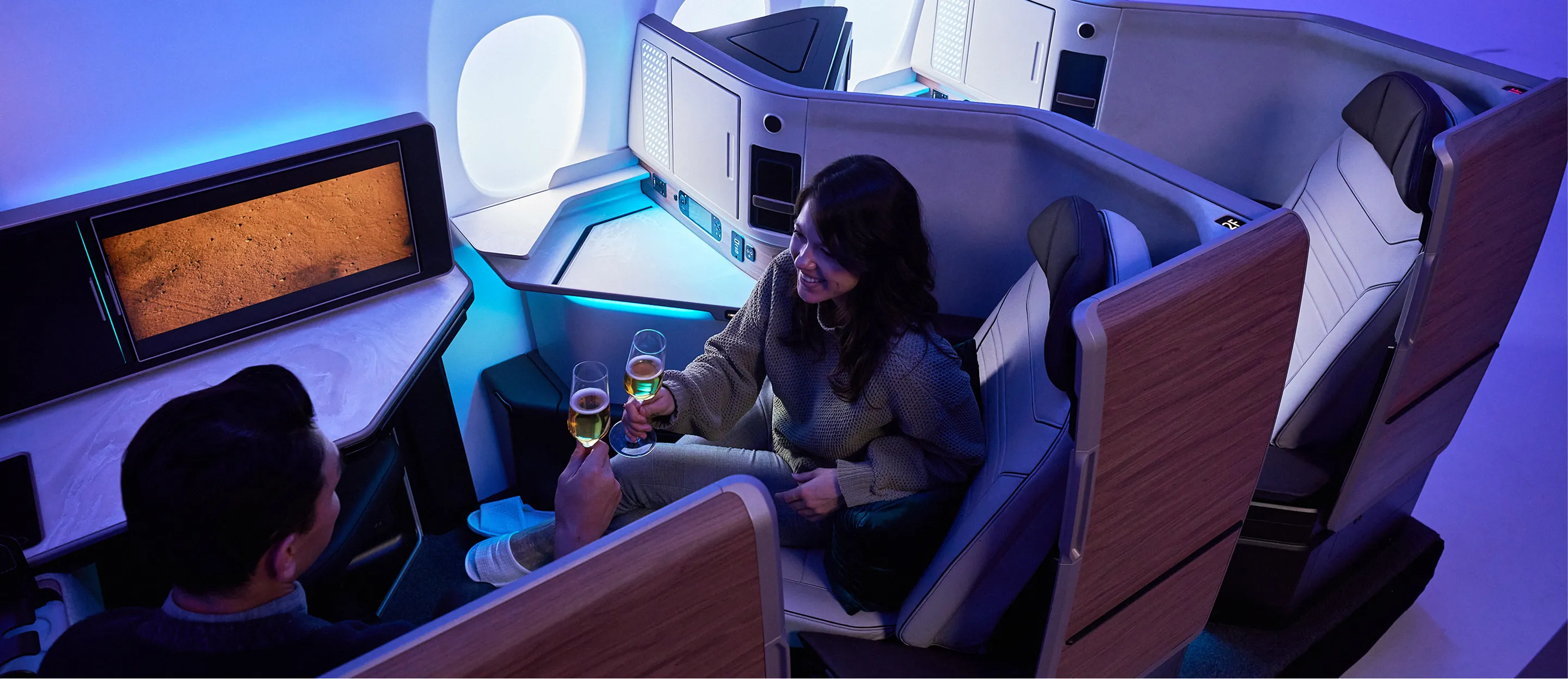 A couple of people that are sitting in a plane.