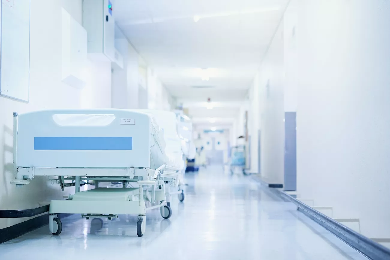 Hospital corridor with patient beds highlighting the need for Legionella control in healthcare facilities