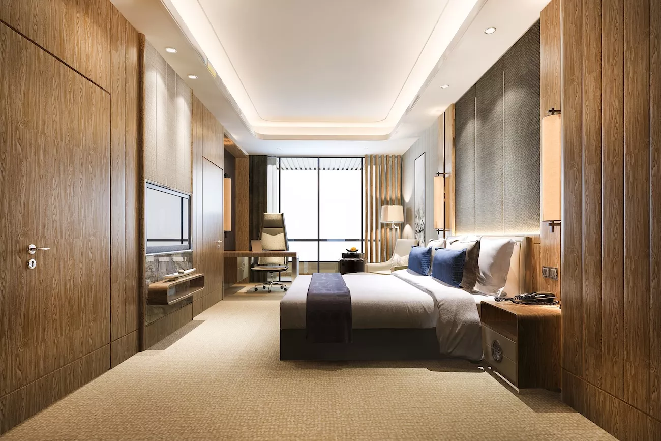 Luxury hotel bedroom interior illustrating the importance of Legionella risk assessments in hotels.
