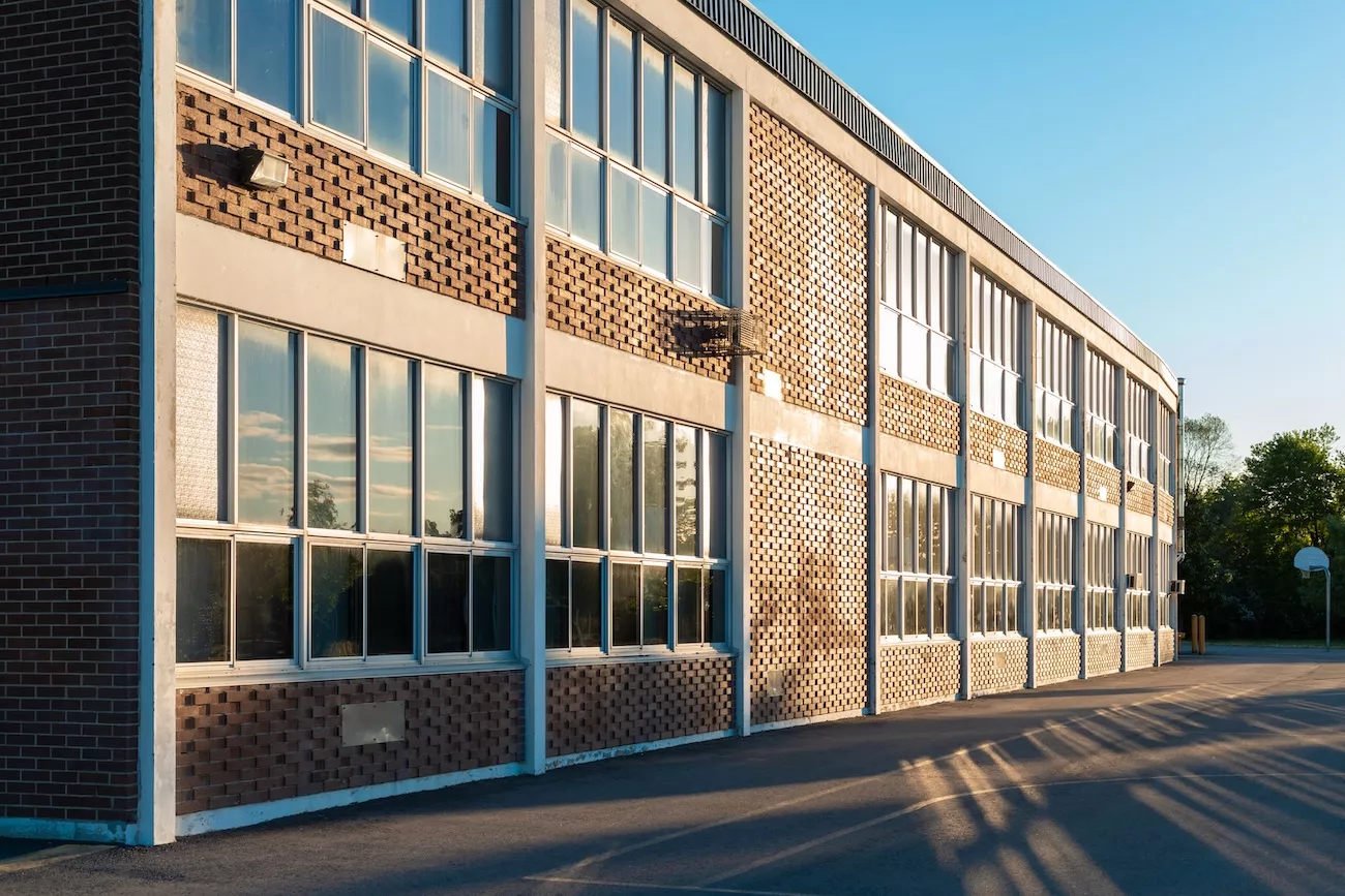 Exterior of a school building representing Legionella water safety management in educational settings.