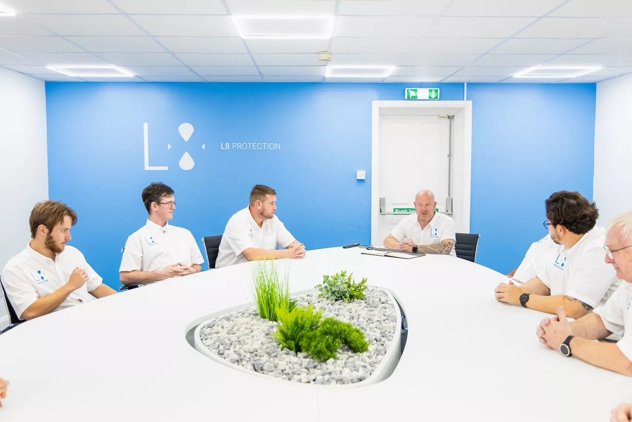 L8 Protection team discussing HSG274 and legionella compliance in a client meeting.