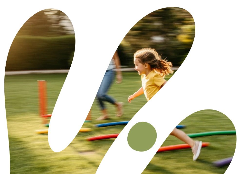 A young girl with blonde hair running joyfully across a grassy field with colorful agility cones, captured in motion with a blurred background
