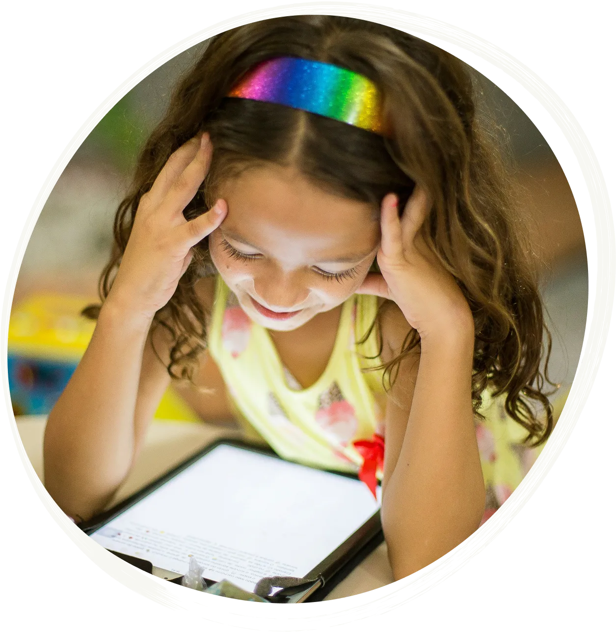 a girl looking at a tablet
