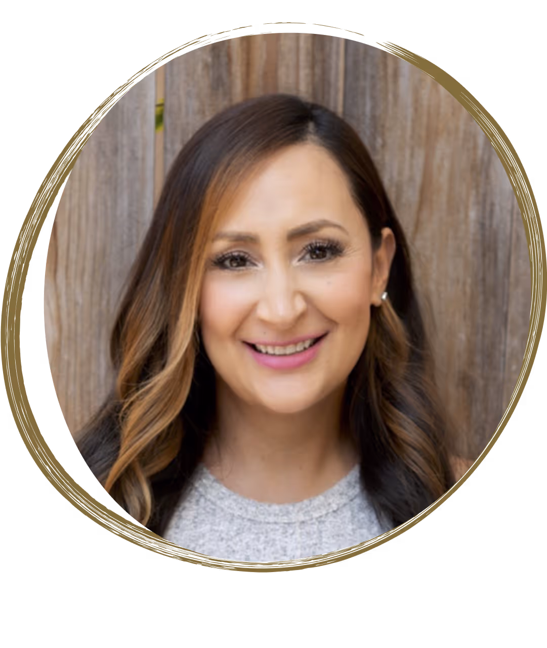 Portrait of Dr. Elise Sanchez, with long wavy brown hair and a smile, standing in front of a wooden background. The card features the badge “Telepsychology” and mentions her license to deliver cross-state telepsychological services.