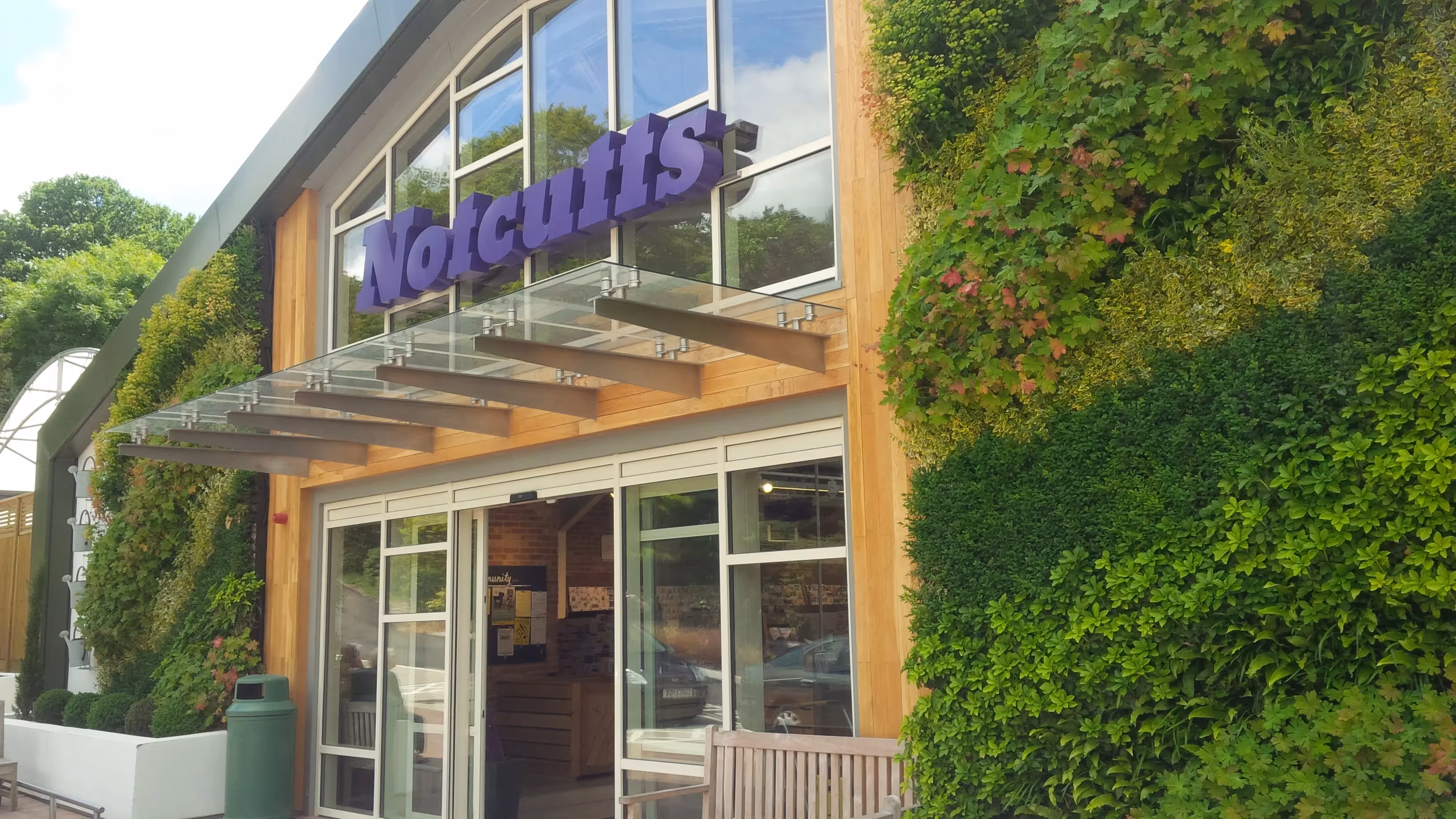 Front exterior of Notcutts, with two large living walls either side of the entrance 