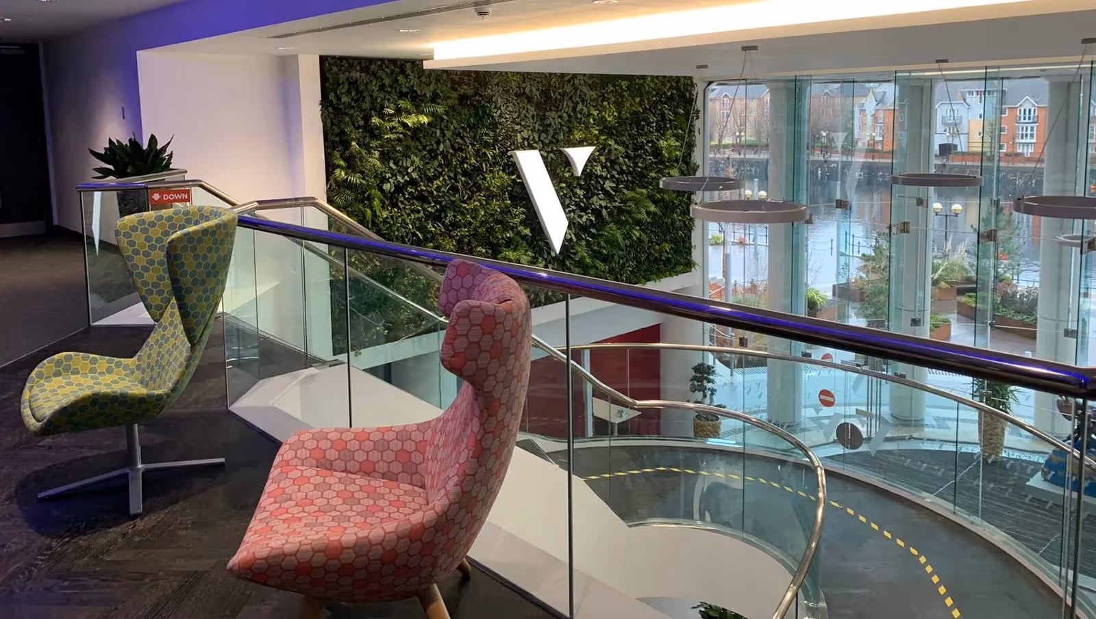 The Viritopia Living Wall Design team stuck to a lush green plant palette, providing a striking contrast against the modern white of the main reception.