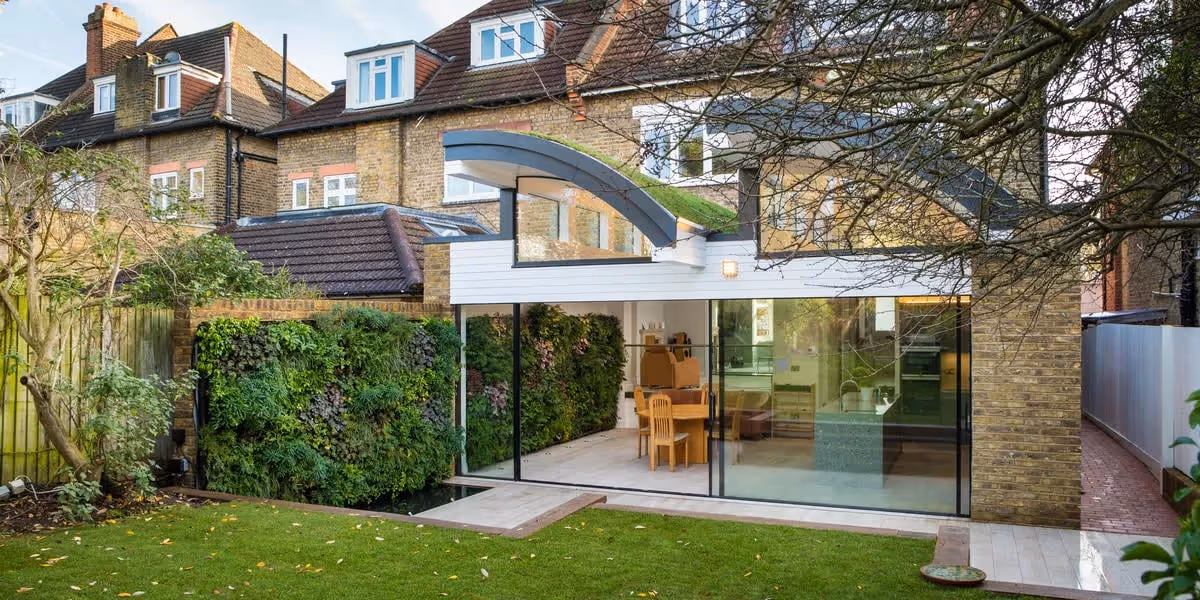 Viritopia crafted two living walls for a London home, connecting indoors and out with specialist glazing, enhancing the space with unique greenery and lighting.