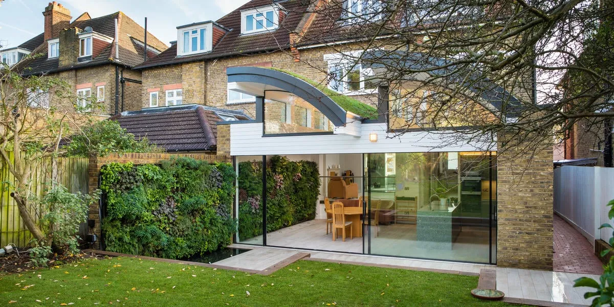 Herondale Avenue residence background with a living wall running between inside the building and the garden