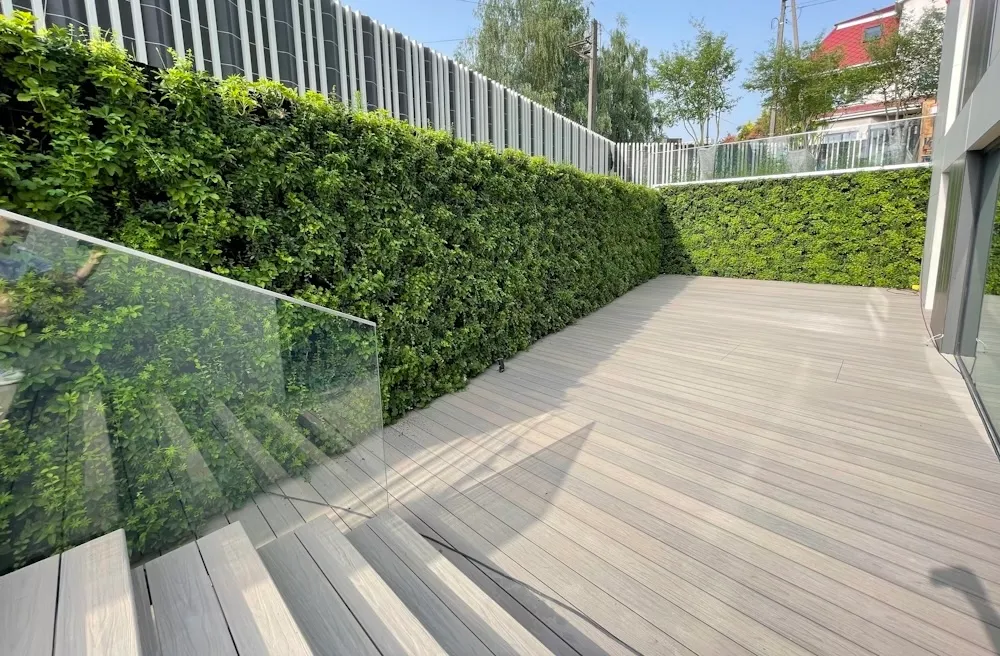 The client wanted a Japanese garden–style living wall, and with Green Systems in Poland we created a vibrant green wall surrounding the decking.