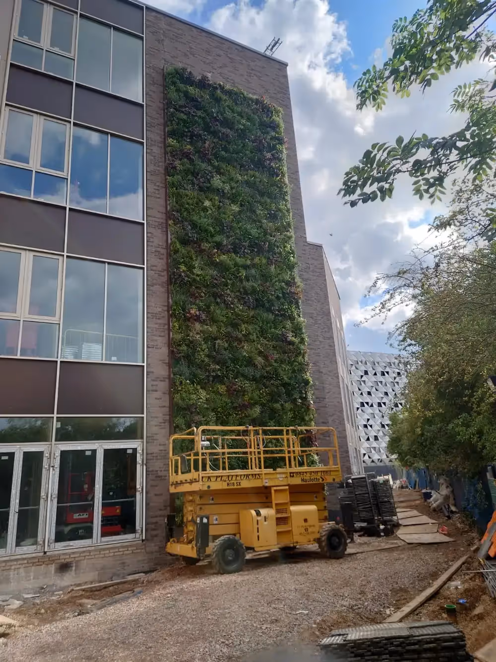 UoL Teaching & Learning Centre under construction with a living wall