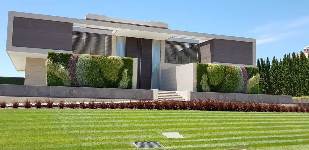 Front exterior of San Lourenco Luxury Villas, with two large exterior living wall
