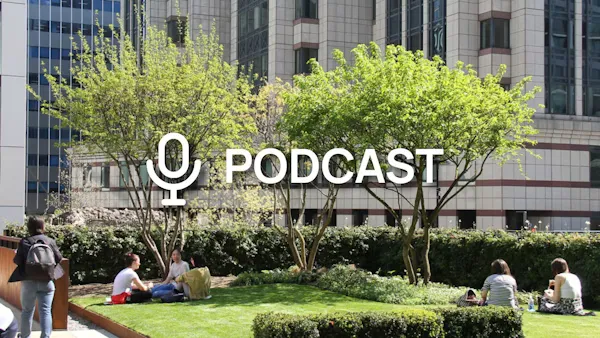 Trees and grass in the background with the word "Podcast" in the foreground