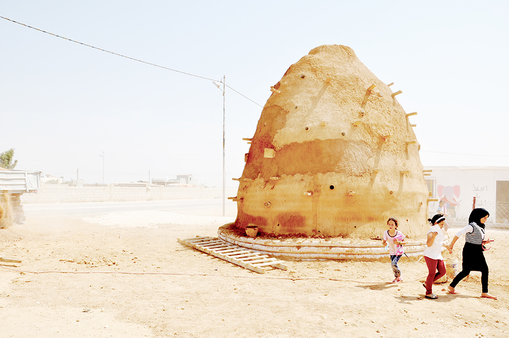 Children in dusty desert landscape