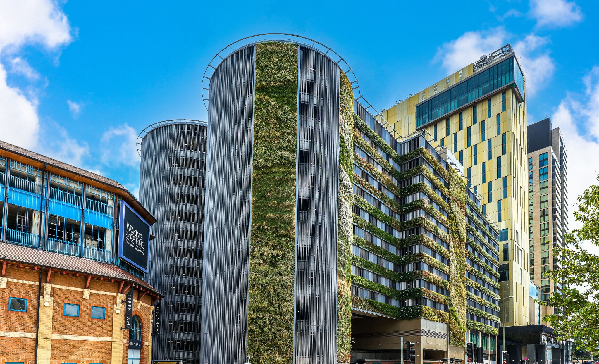 Modern living wall integrated into sleek urban architecture with green vertical gardens
