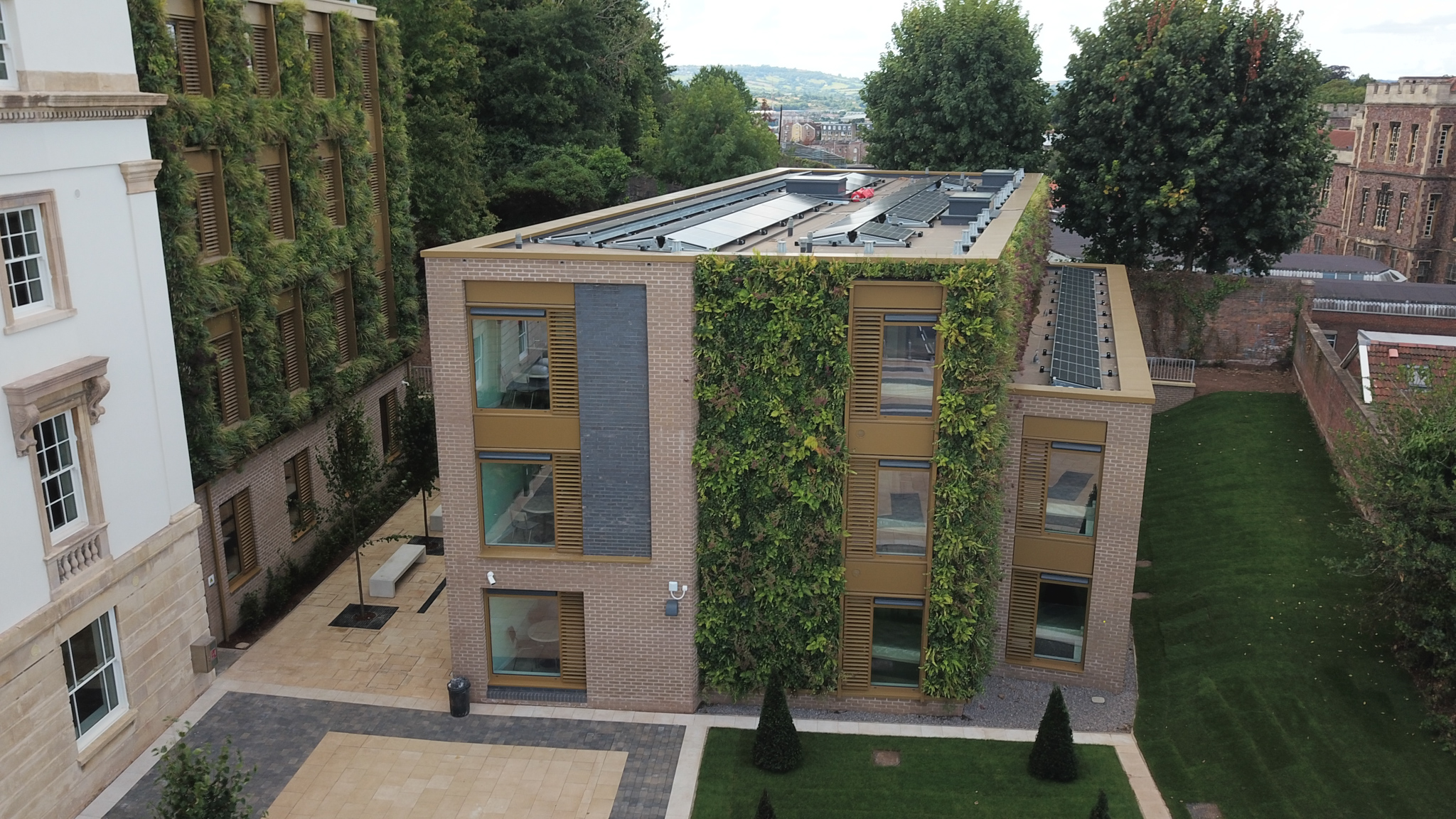 Living wall adorns modern sustainable building with green vertical gardens