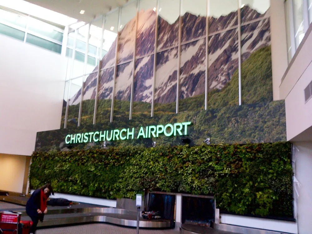 Christchurch Airport baggage claim with mountain landscape wall mural
