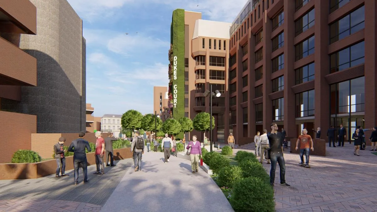 Urban pedestrian plaza with modern buildings and green landscaping