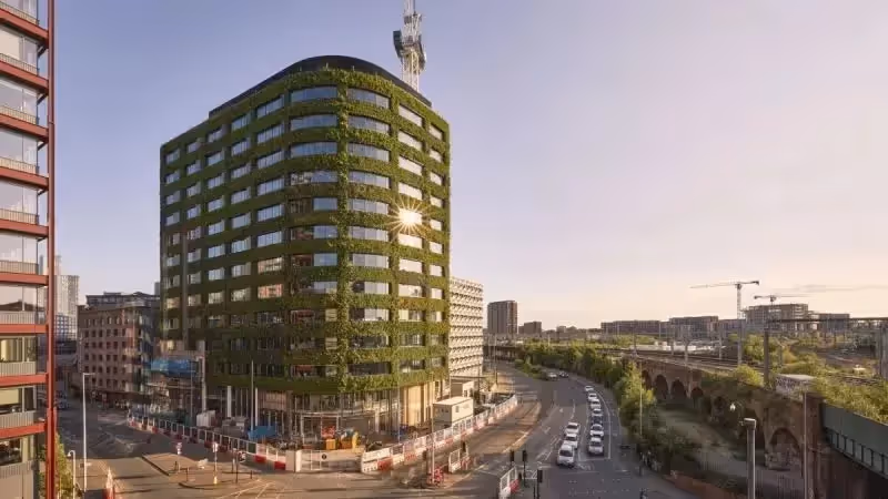 Construction phase of the living wall of Eden at New Bailey, showing cranes and building works around the living wall