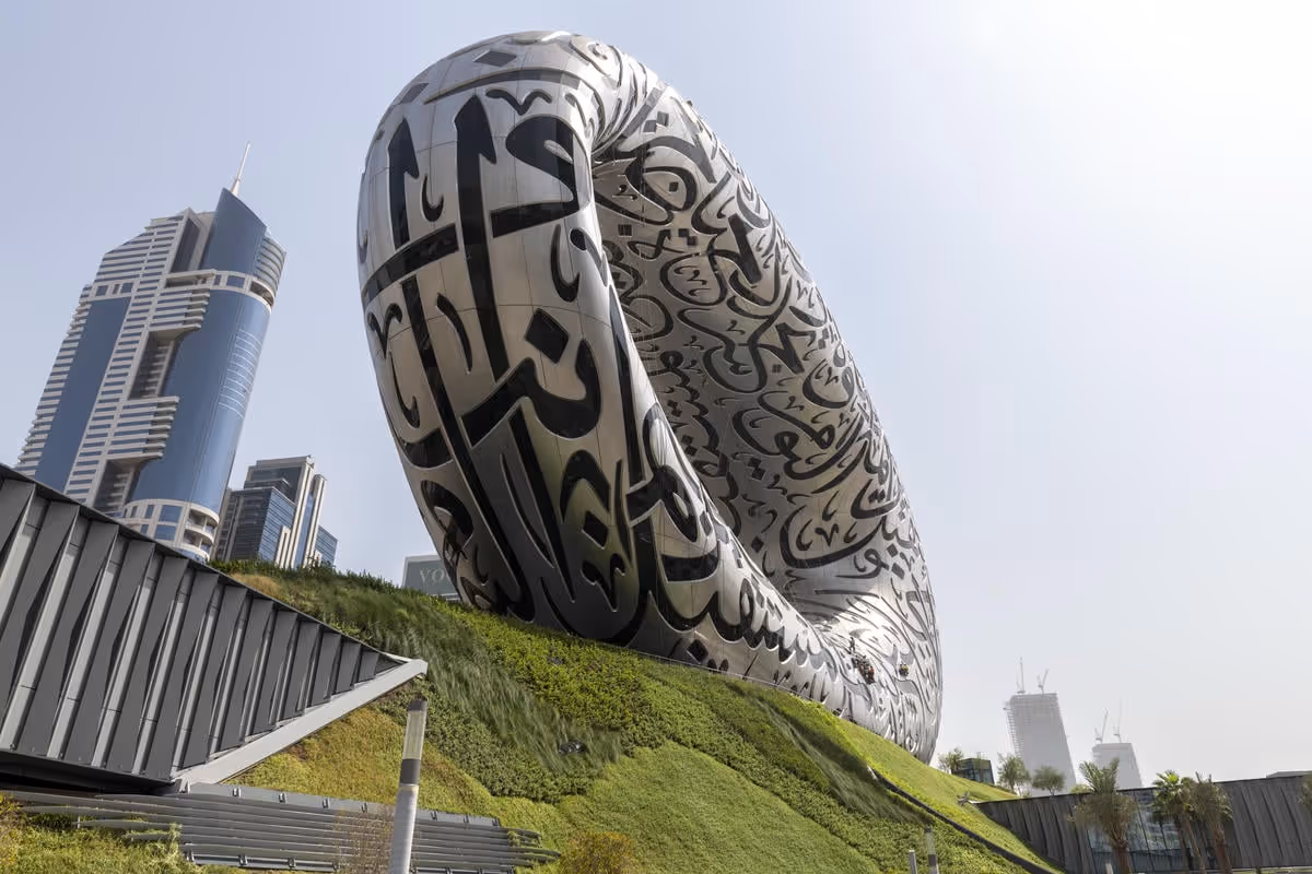 Upwards view of the museum of the future showing viritopia's living wall curving around the base