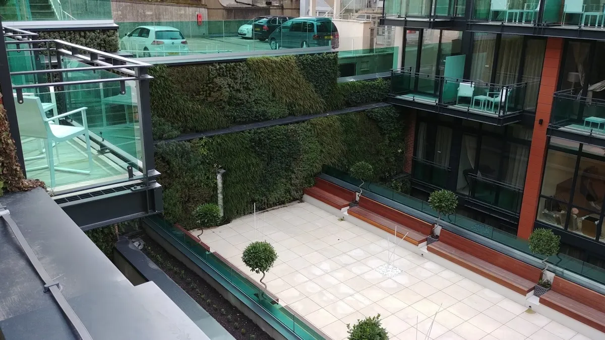 Bravo Hotel exterior, with a large living wall