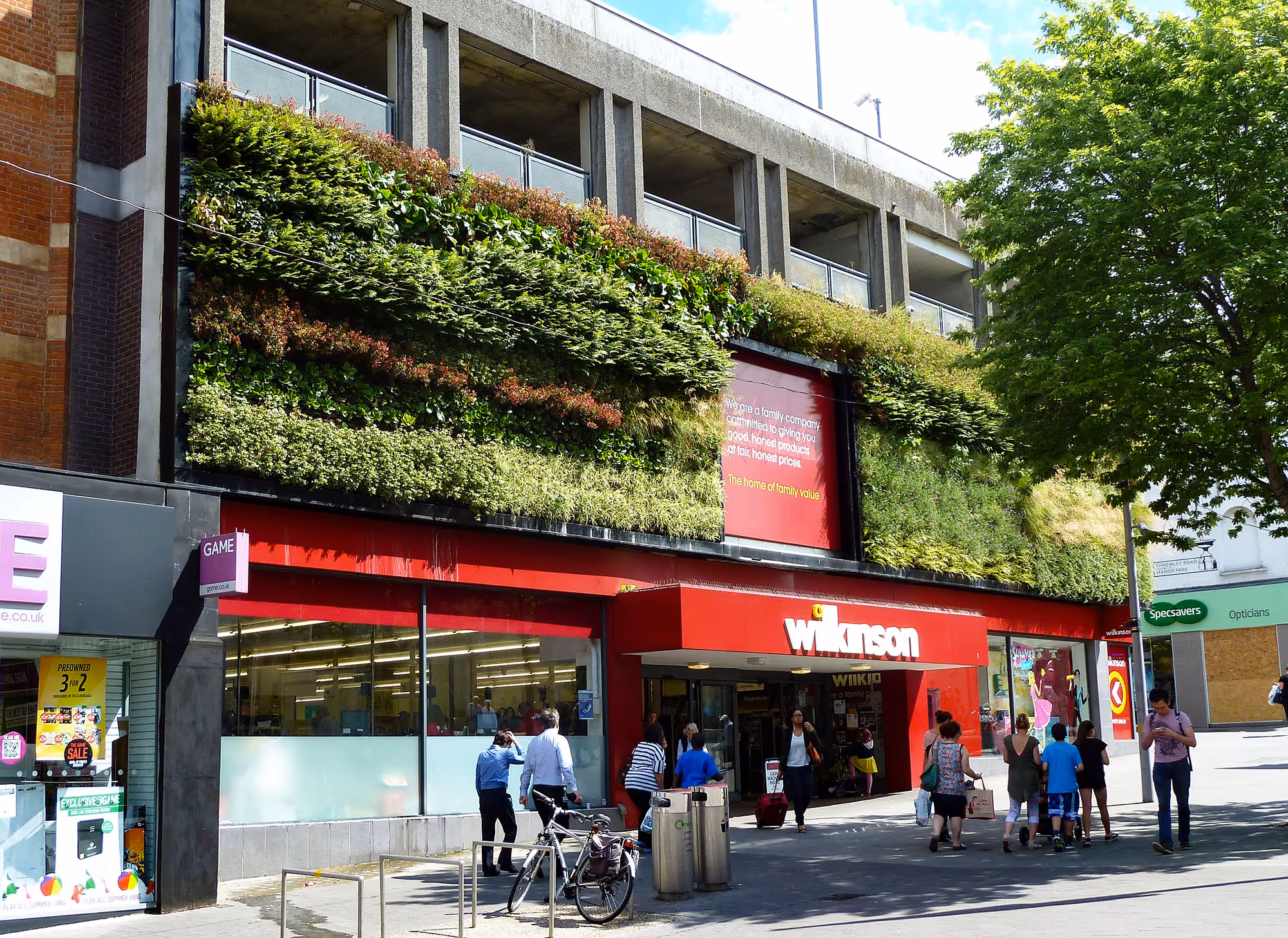 Front exterior of Wilkinson on Sutton High Street, with exterior living wall feature above the entrance