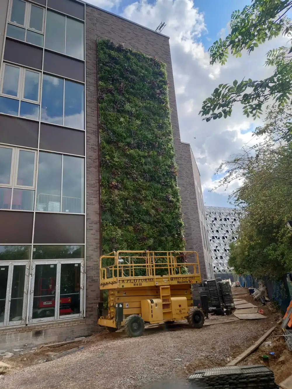 UoL Teaching & Learning Centre under construction with a living wall