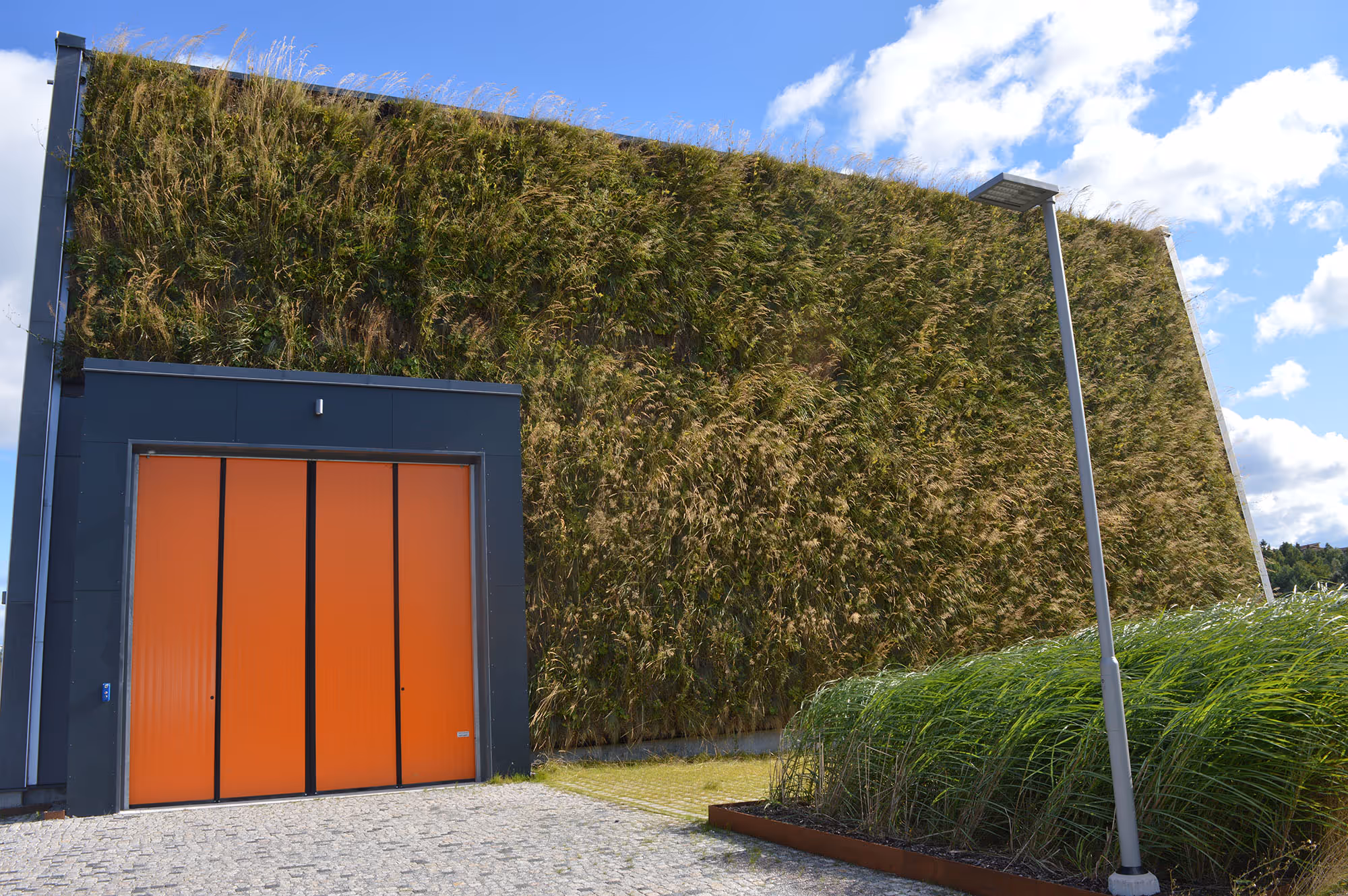 Ursvik Recycling Centre exterior, covered in a living wall