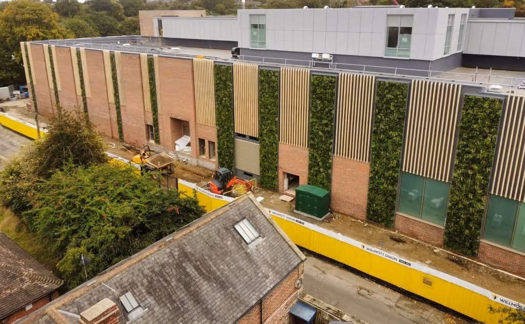 The ten tall living walls are placed intermittently along the length of the centre, going from wide to narrow as they reach the end of the building.