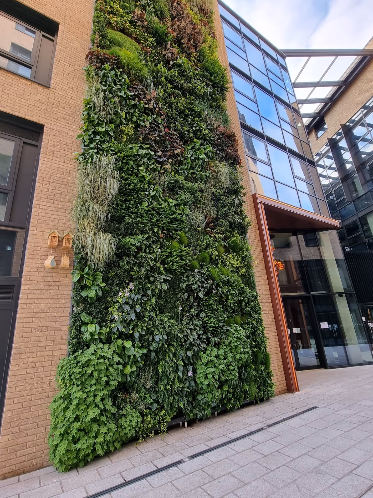 Exterior of The Distillery, Glassfields, with a large living wall