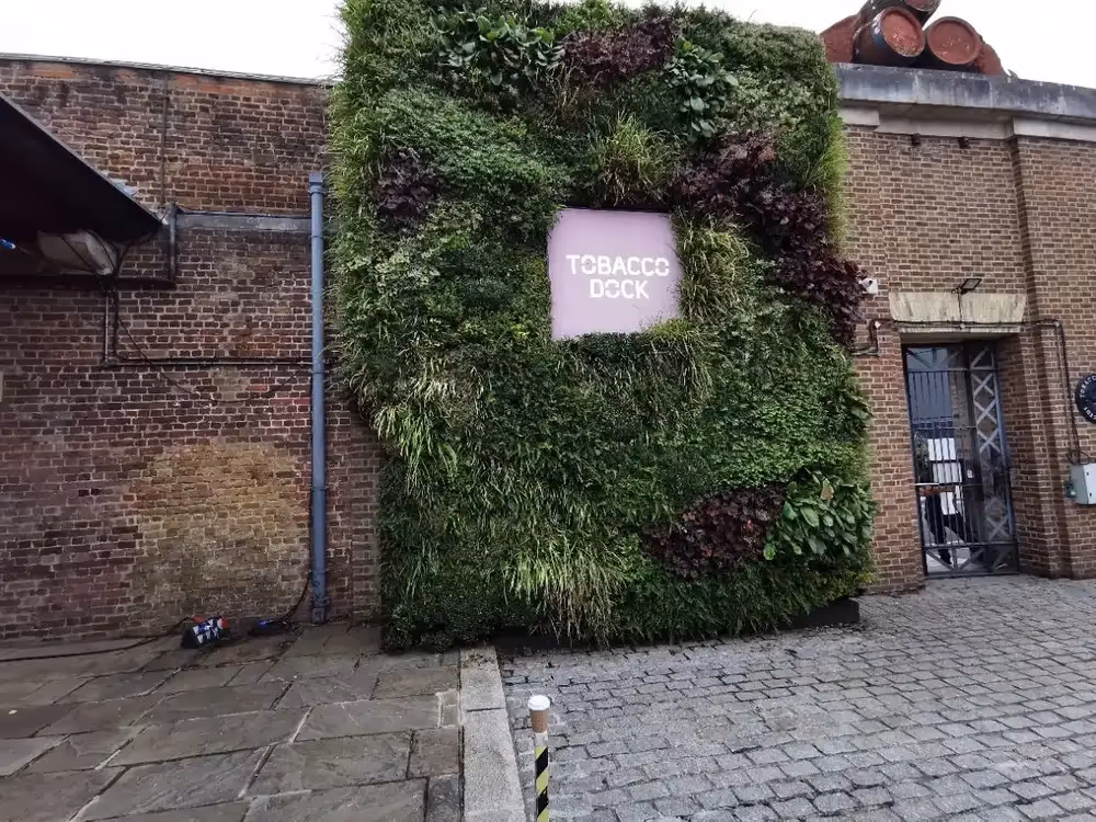 Dotted around the space are corten steel planters and wood seating areas, all bursting with plants such as lavender, rosemary and many more.
