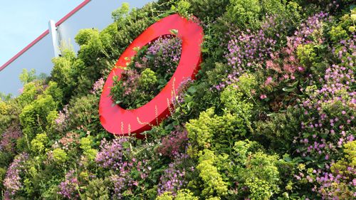 Living wall on the Equinix Data Centre FR10 in Frankfurt, Germany with a cherry picker building the living wall