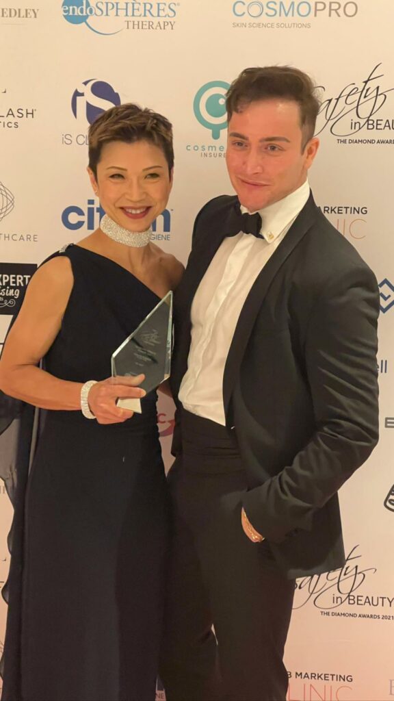 CC Kat and Dr Leo have photo with award