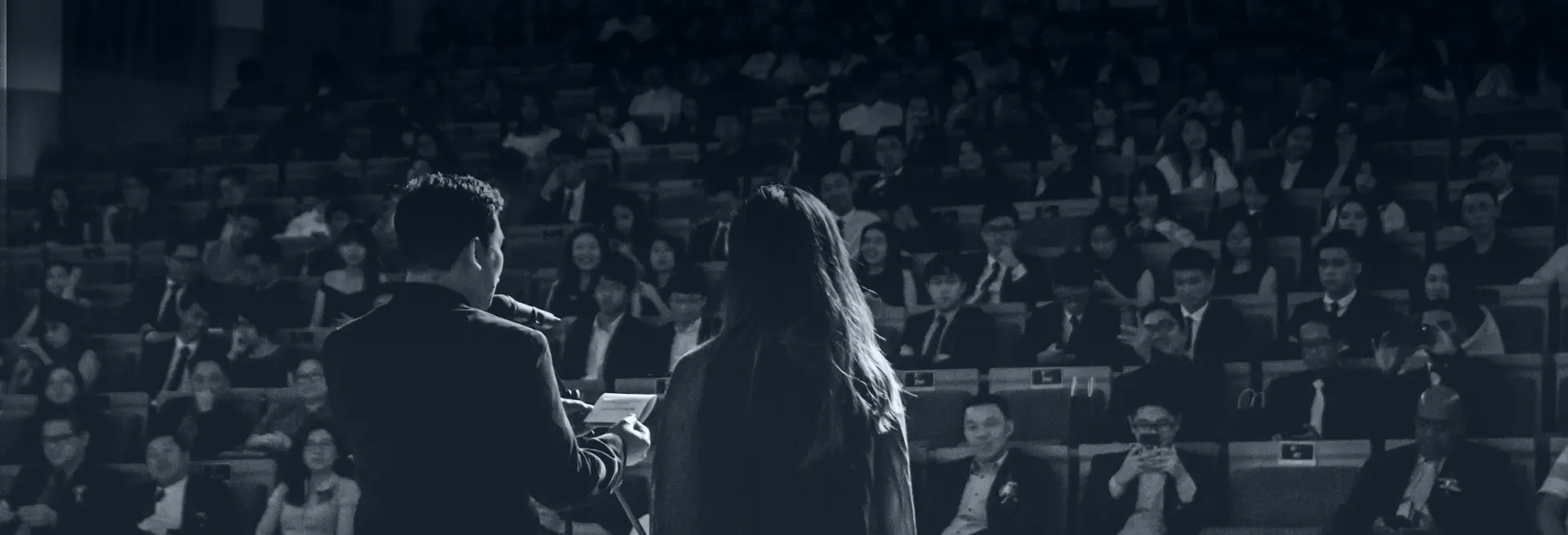 speaker presenting in front of audience