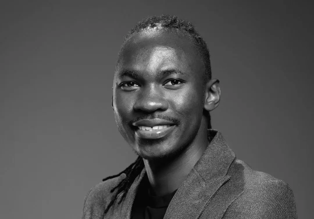 emmanuel trinity gray headshot