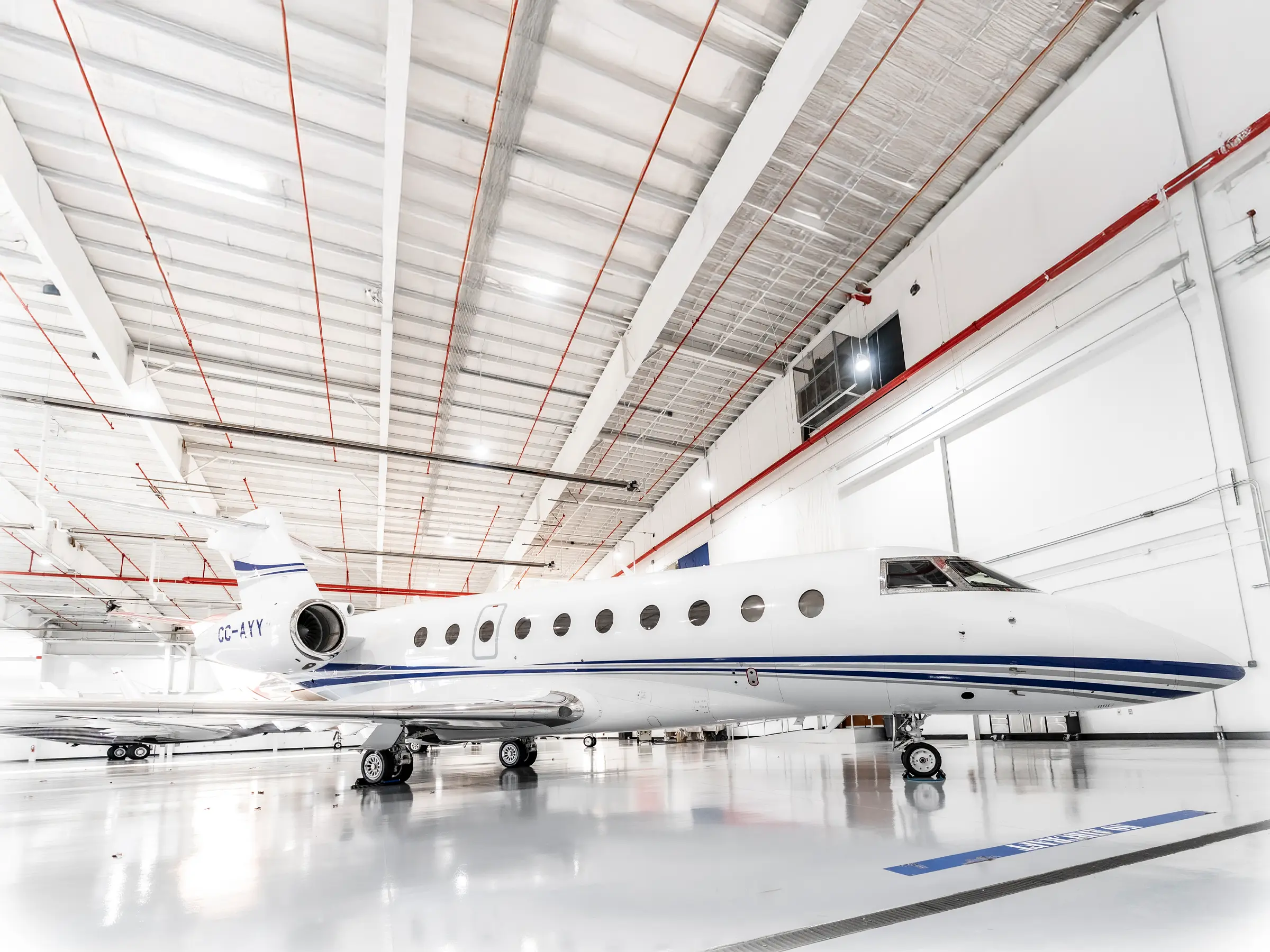 The main cabin of the Falcon 2000LX through the forward galley toward the cockpit