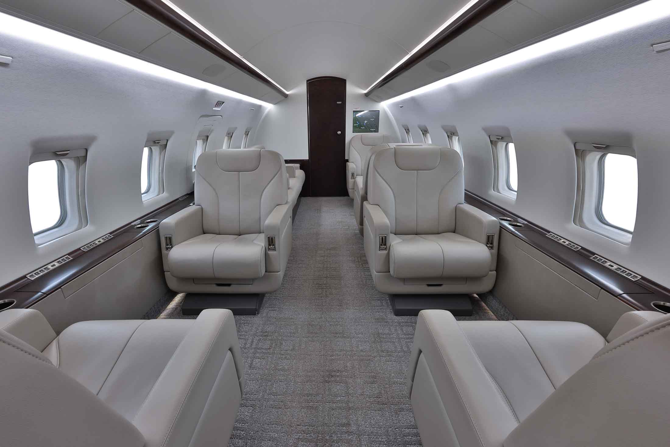Private Jet Sales Bombardier Challenger 604 seating area captain's chairs contact to acquire this aircraft