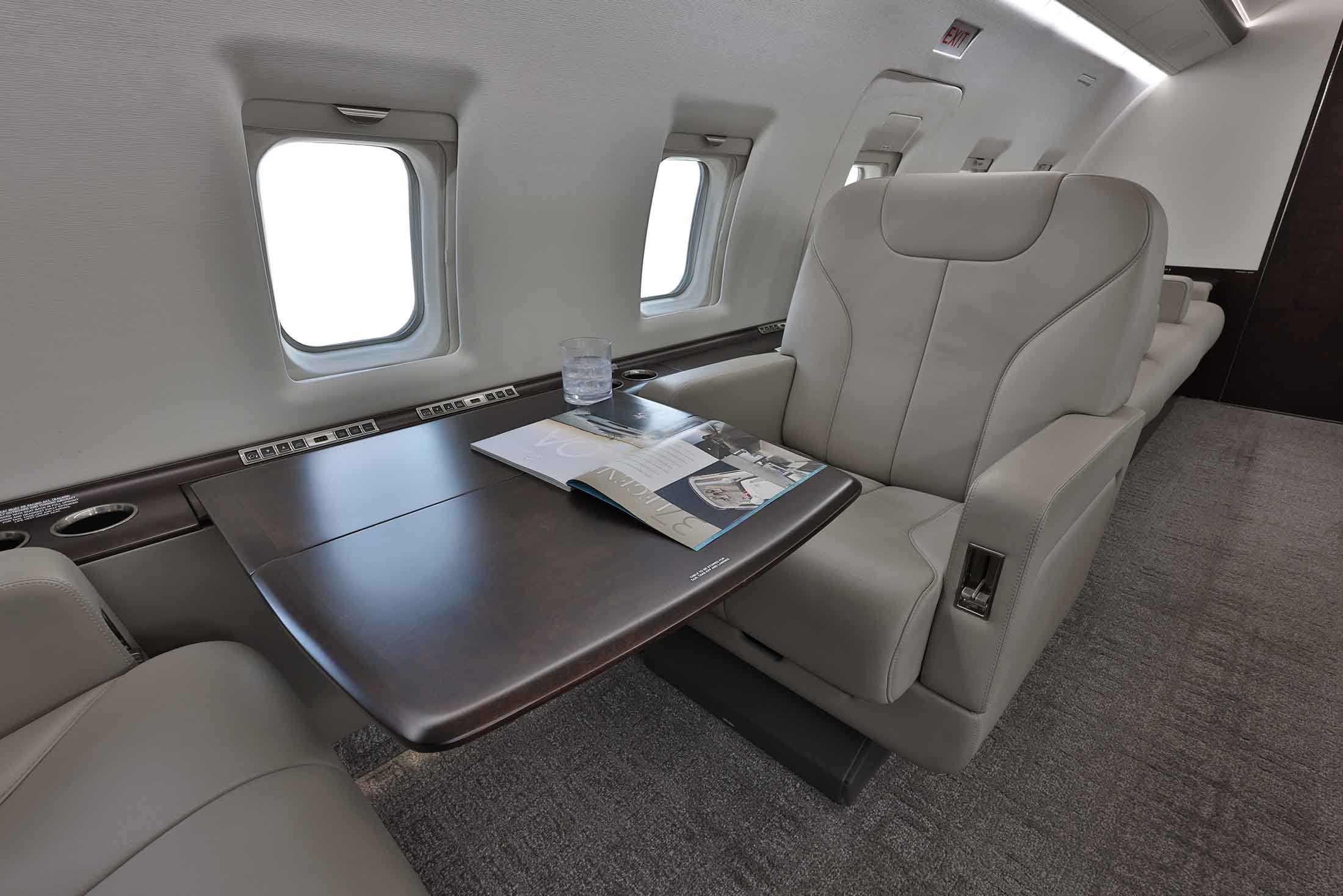 Private Jet Sales Bombardier Challenger 604 dining area contact to acquire this aircraft